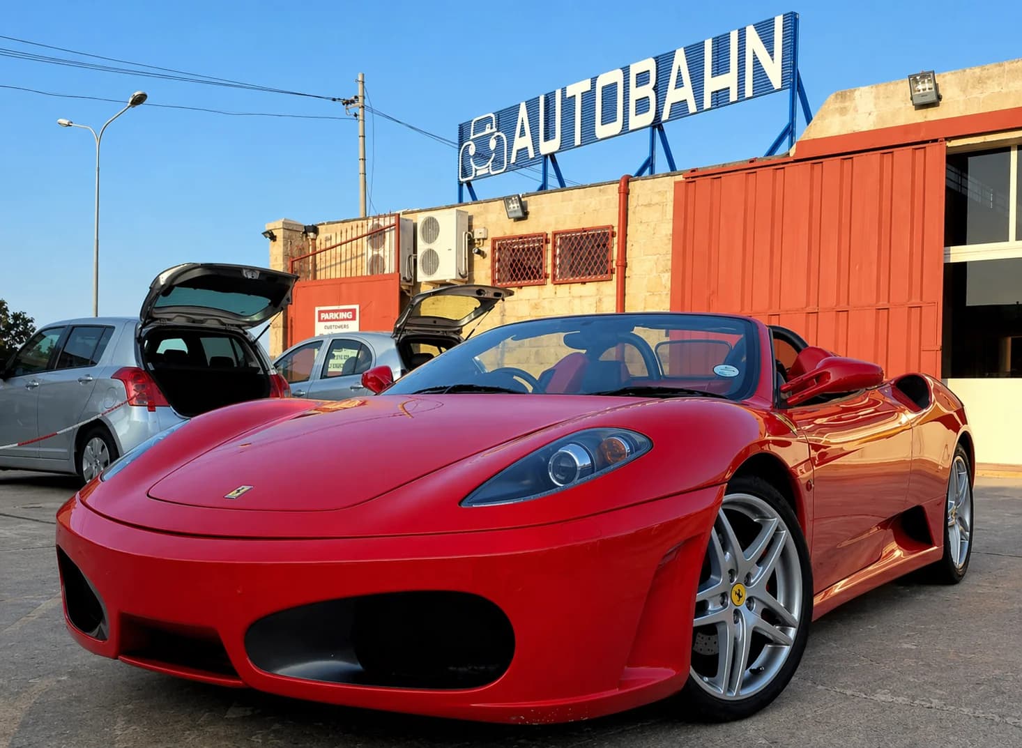 Red Ferrari convertible at Autobahn Malta